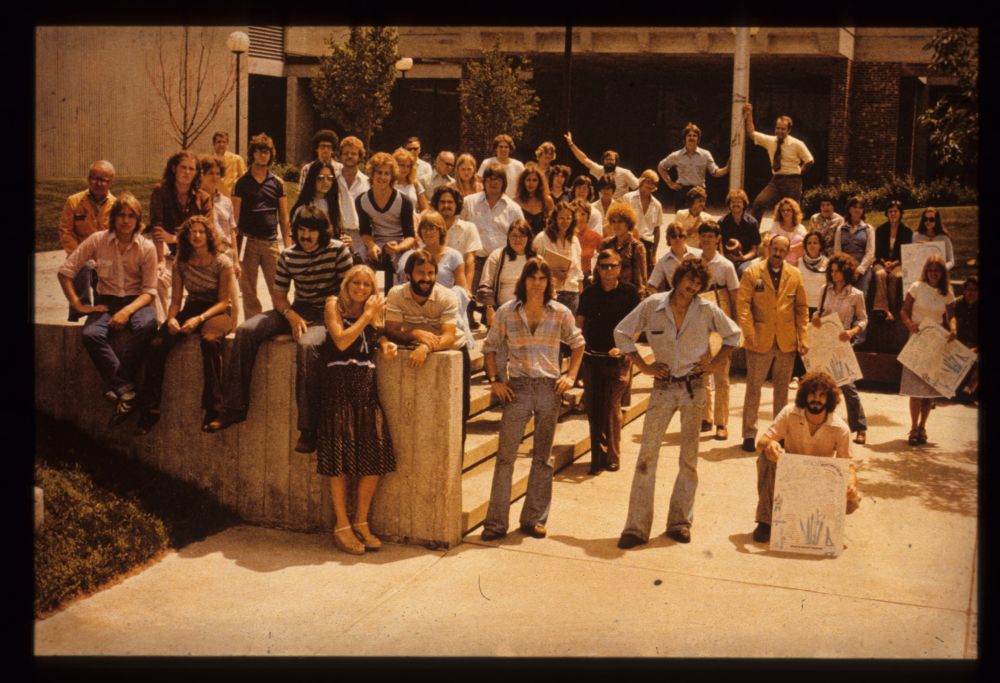 A group of students gather outside