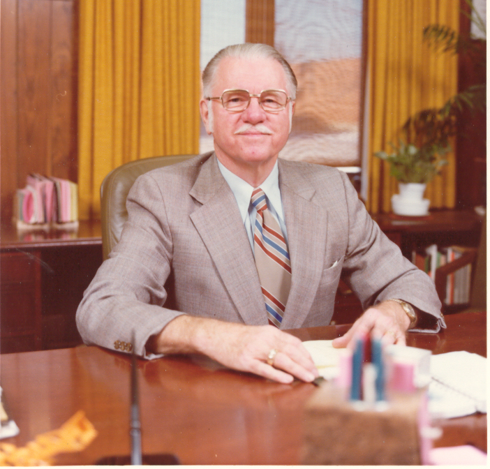Dr. Richard Emery sits at a desk.