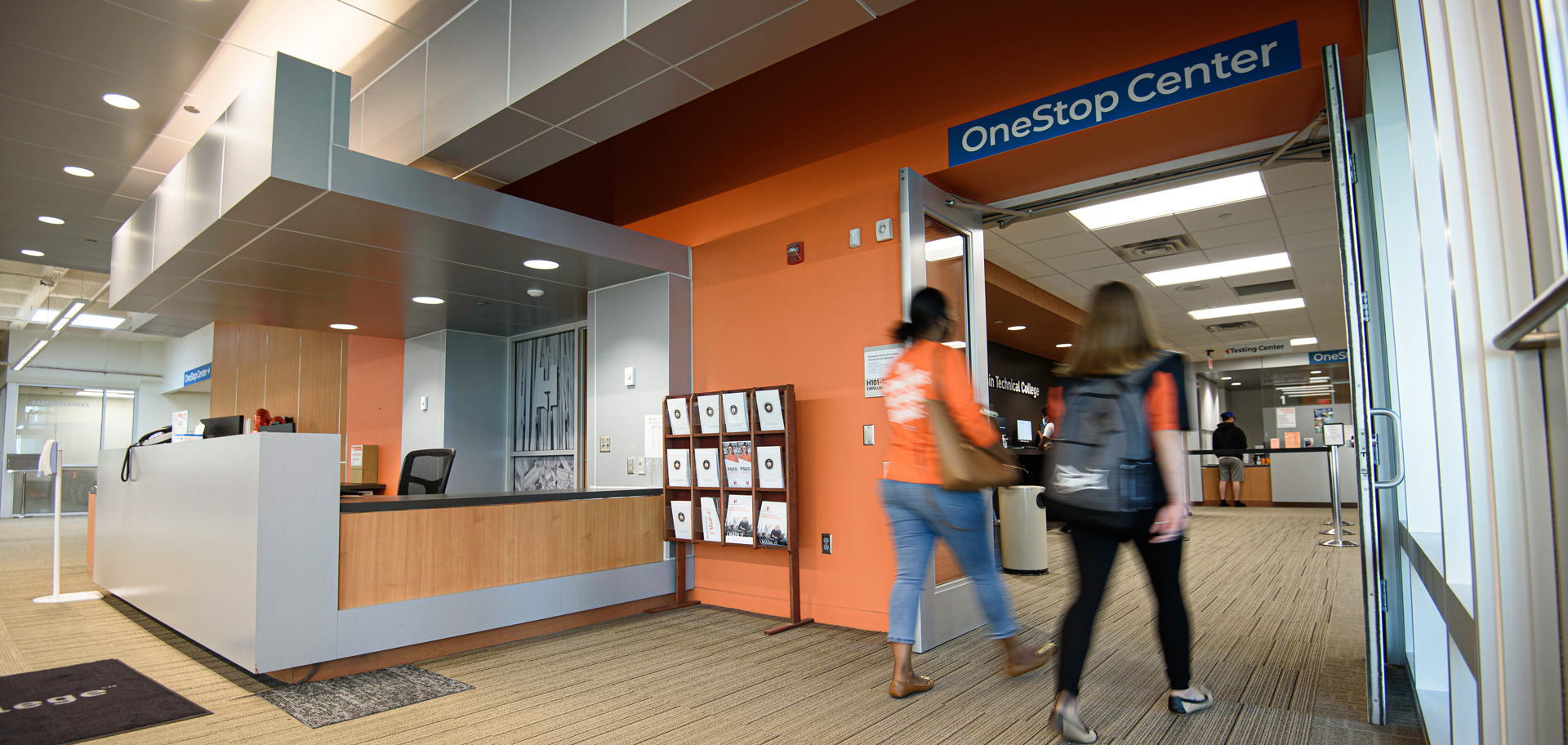 Two students walking into OneStop Center