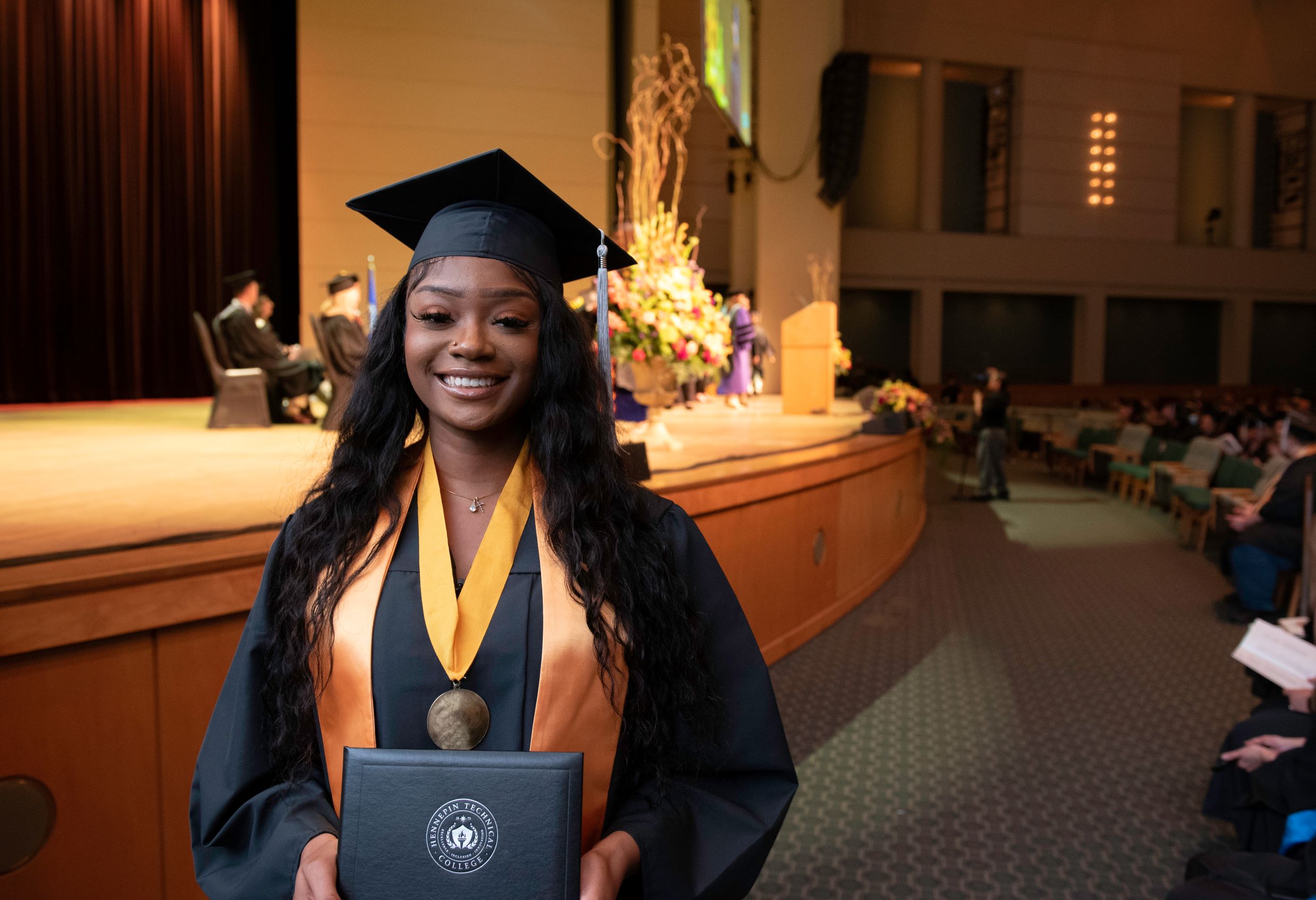 Nursing graduate holds diploma