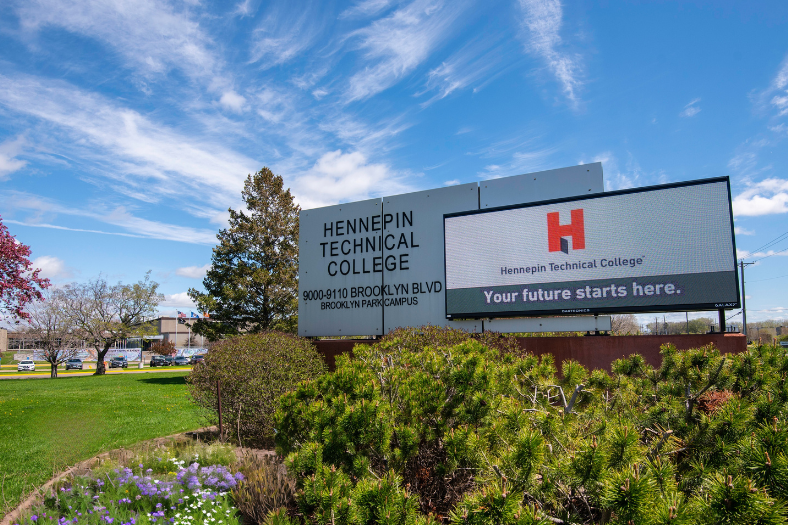 The Brooklyn Park outdoor marquee on a sunny summer day with a banner reading Your Future Starts Here. 