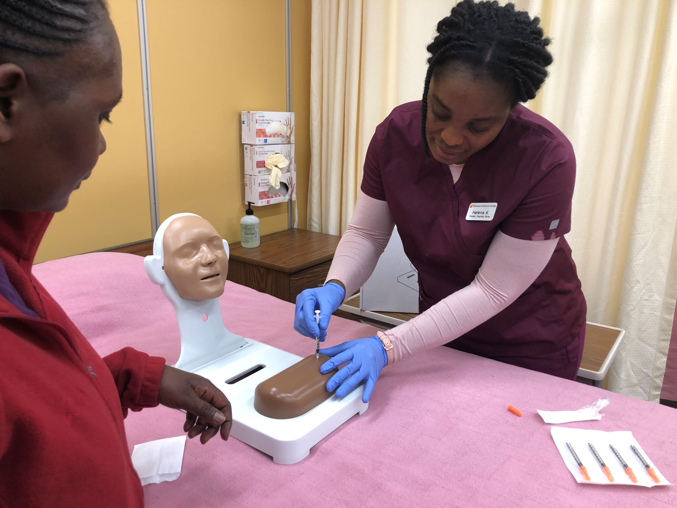 Nursing students practice skills